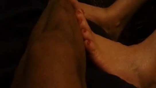 Sexy milf with rubs feet on dude for money